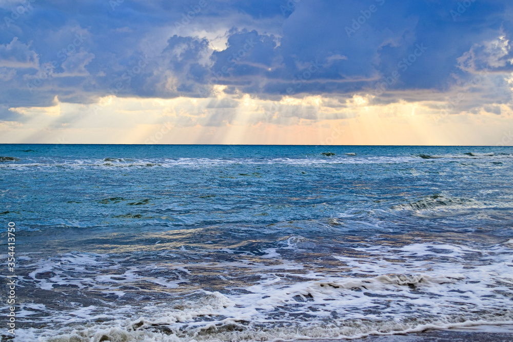 colorful sunset on a sandy beach in Turkey, Golden highlights of the sun on the waves colorful sunset on a sandy beach in Turkey, Golden highlights of the sun on the waves