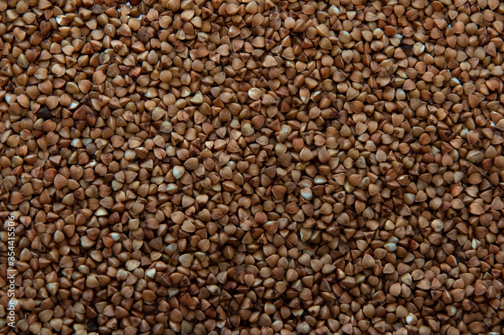 Buckwheat seeds as food background. Top view. Buckwheat seeds as food background. Top view.