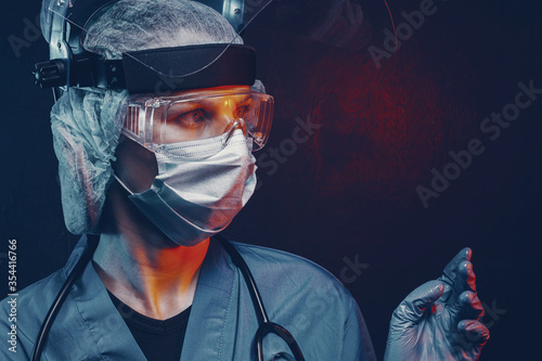 female doctor in medical suit on a dark background in the light of emergency lights of ambulances