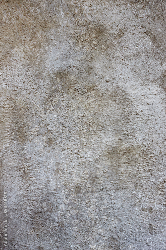 Obraz premium Vertical closeup of a texture of gray raw concrete