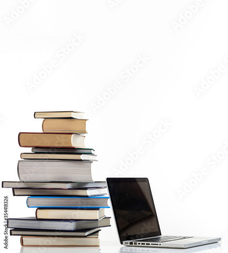 Billede på lærred Elearning, books stack and a laptop isolated on white background