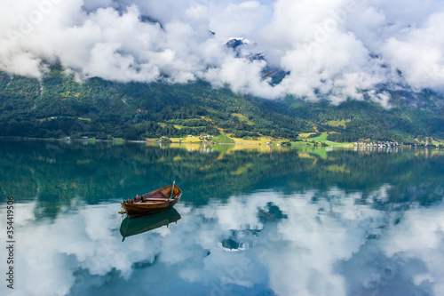 clouds over Oppstrynsvatnet lake in Norway photo