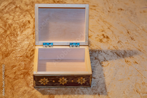 Small elegant retro casket of precious wood for storing valuables and jewelry