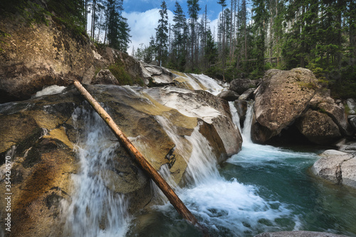 Waterfalls of Cold stream in Great Cold Valley in High Tatras, Slovakia. photo