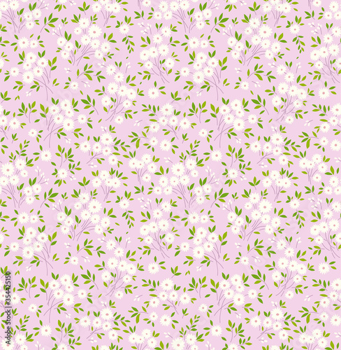 Floral pattern. Pretty flowers on light pink background. Printing with small white flowers. Ditsy print. Seamless vector texture. Spring bouquet.