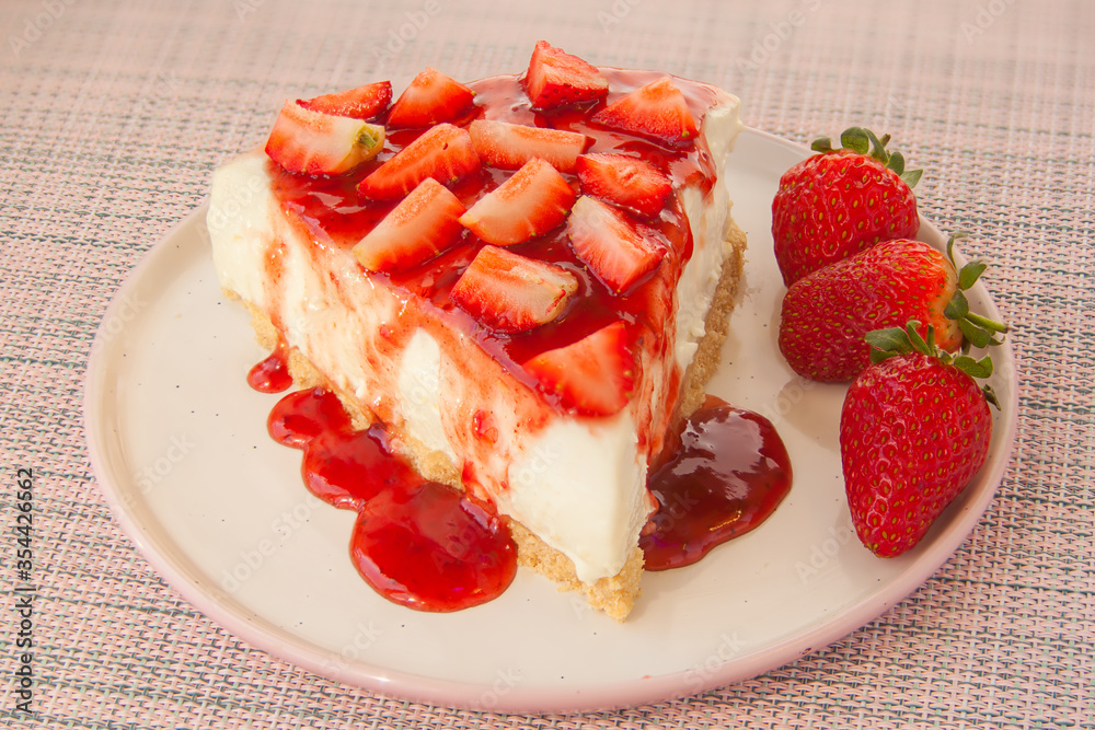 delicious cheesecake with strawberries on plate delicious cheesecake with strawberries on plate