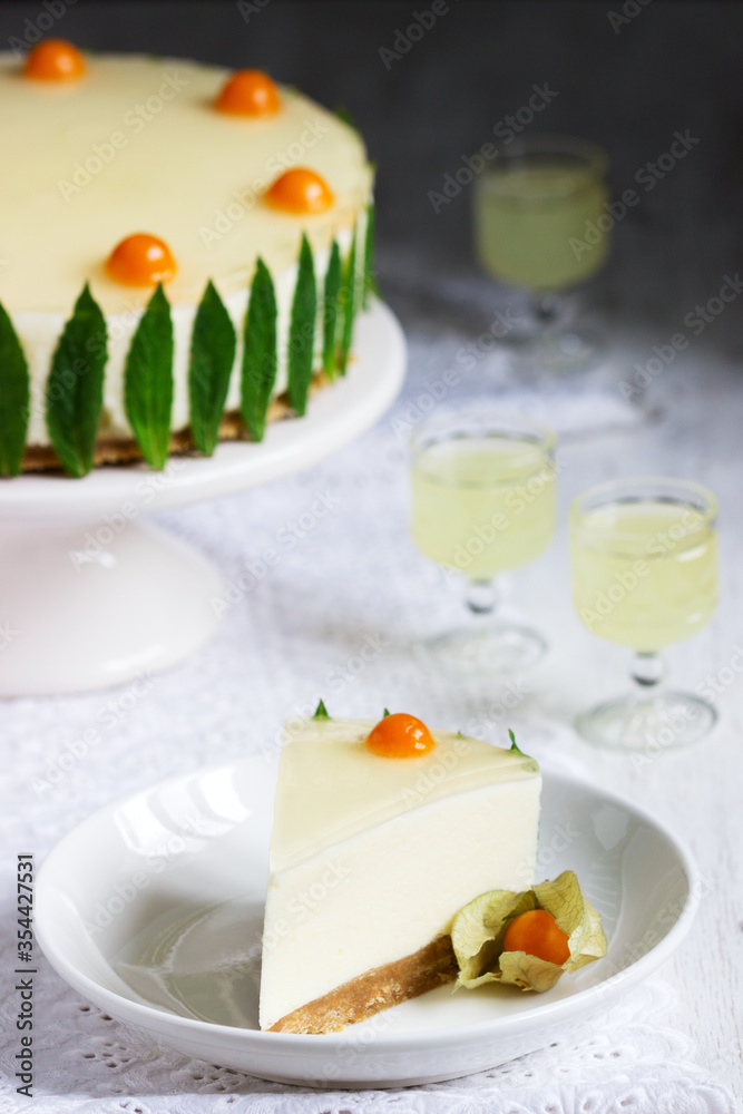 Mousse cake with cream, condensed milk and lime juice, garnished with jelly and physalis, served with limoncello. Mousse cake with cream, condensed milk and lime juice, garnished with jelly and physalis, served with limoncello.