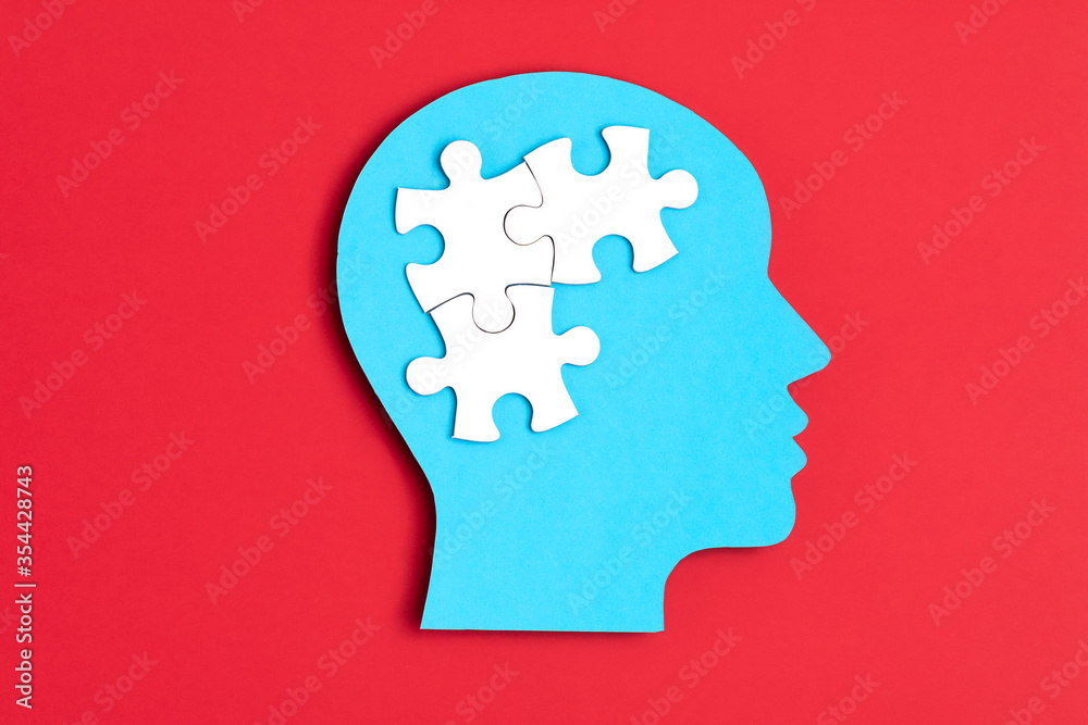 Papercut head with jigsaw puzzle pieces inside. Mental health problems, psychology, memory, logic, thinking process, solution, mental illness Papercut head with jigsaw puzzle pieces inside. Mental health problems, psychology, memory, logic, thinking process, solution, mental illness