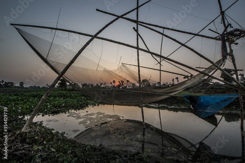 Fishing net in a Bangladeshi village during sunset.