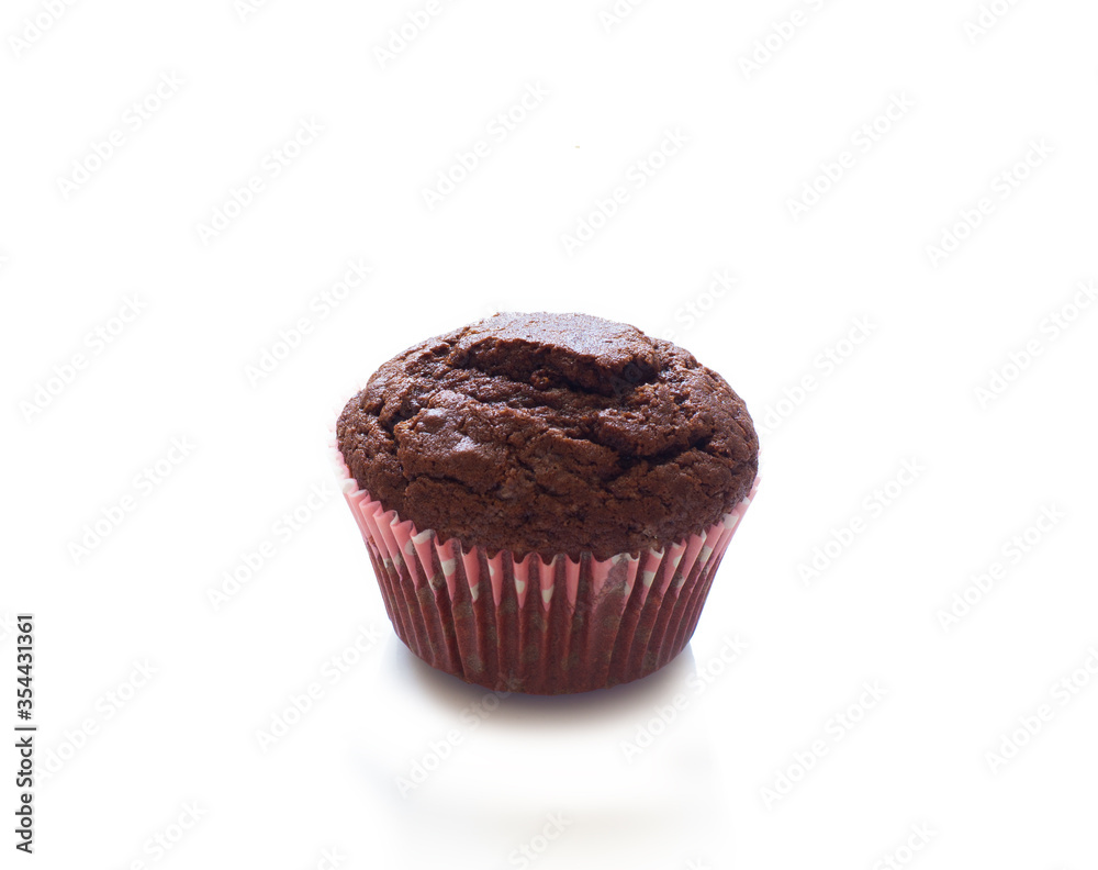 Chocolate miffin in a paper tin isolated on a white Chocolate miffin in a paper tin isolated on a white
