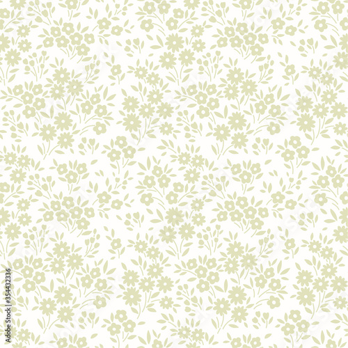 Vintage floral background. Seamless vector pattern for design and fashion prints. Floral pattern with small light gray flowers on a white background. Ditsy style.
