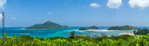 Beautiful tropical seascape with islands in turquoise sea water and blue sky. Tropical background scenic. panoramic format © mathilde
