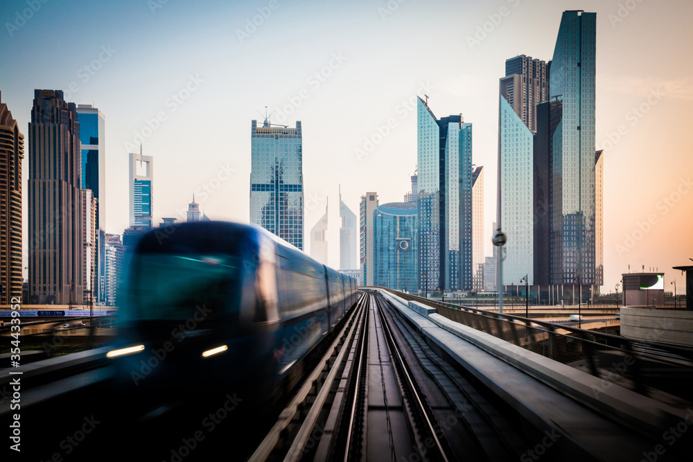 Naklejka premium Dubai Financial Center in the mornin, view from train.