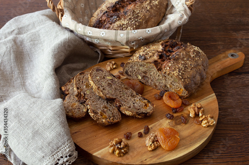 Brown bread with walnuts and drt fruits photo