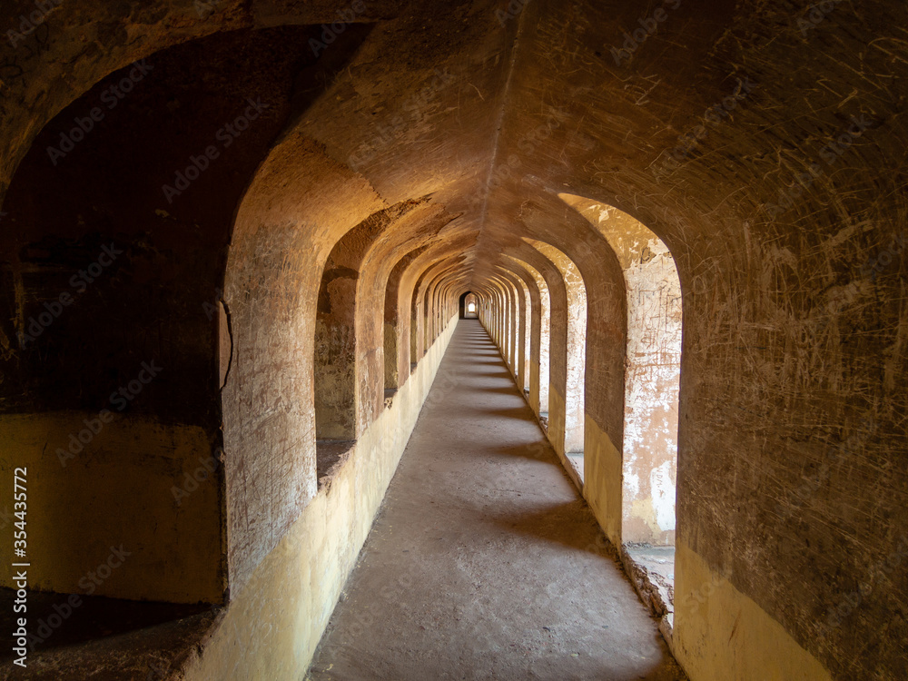 An arcaded passage inside the Bhulbhulaiya labyrinth in Lucknow