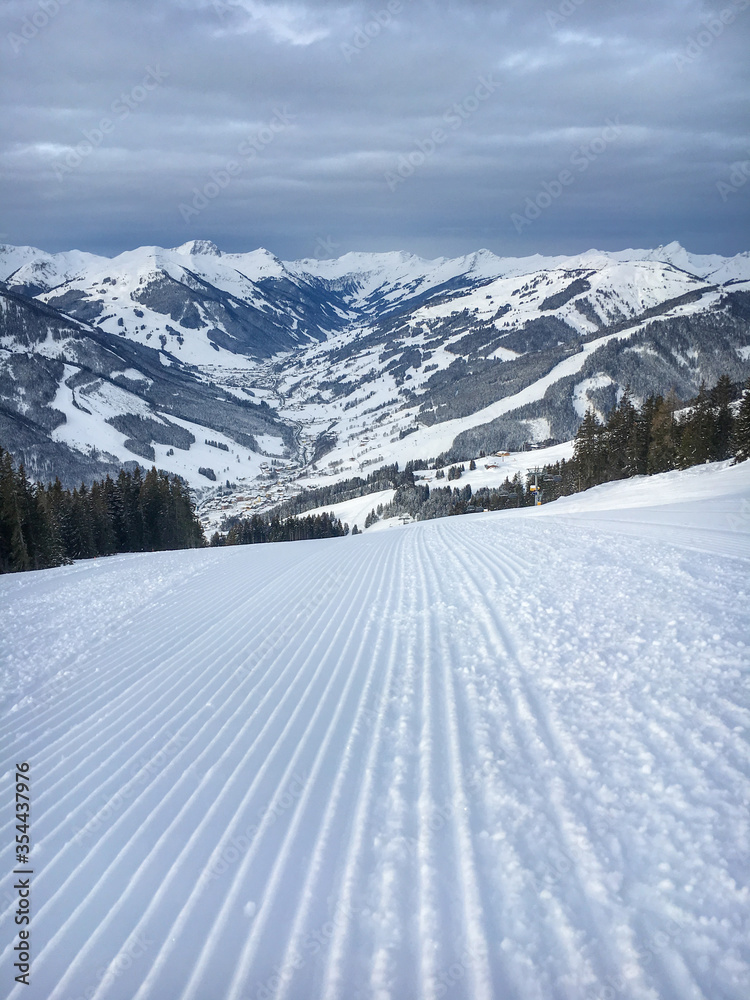 Ski slope with scenic view in the region Saalbach Hinterglemm in the Austria alps .