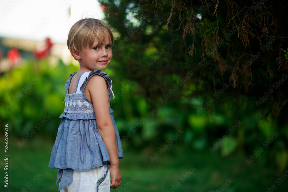 Close up portrait of beautiful smiling little girl in a blue shirt, Close up portrait of beautiful smiling little girl in a blue shirt,