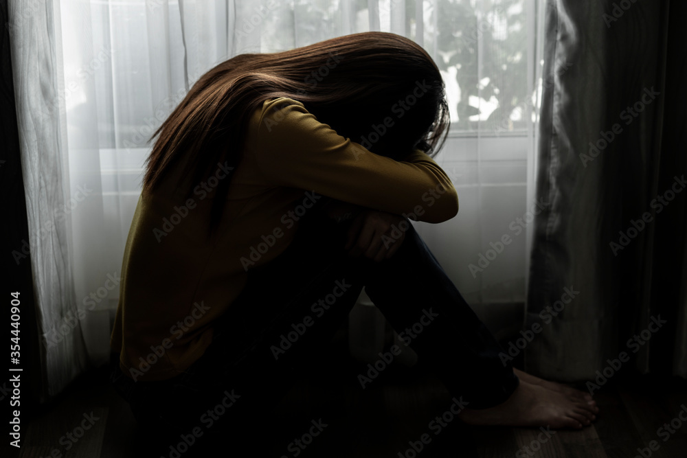 Sad young woman sitting on the bed in the bedroom, People with depression concept, people bad frustrated exhausted feeling down. Sad young woman sitting on the bed in the bedroom, People with depression concept, people bad frustrated exhausted feeling down.