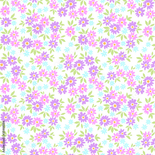 Vintage floral background. Seamless vector pattern for design and fashion prints. Flowers pattern with small pink and lilac flowers on a white background. Ditsy style.