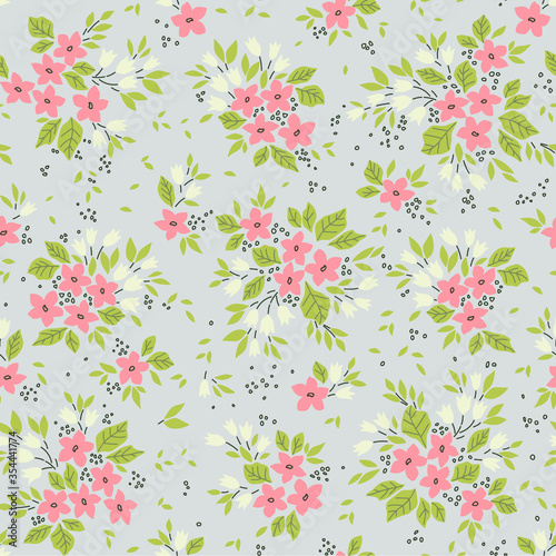 Vintage floral background. Seamless vector pattern for design and fashion prints. Flowers pattern with small white and pink flowers on a gray background. Ditsy style.