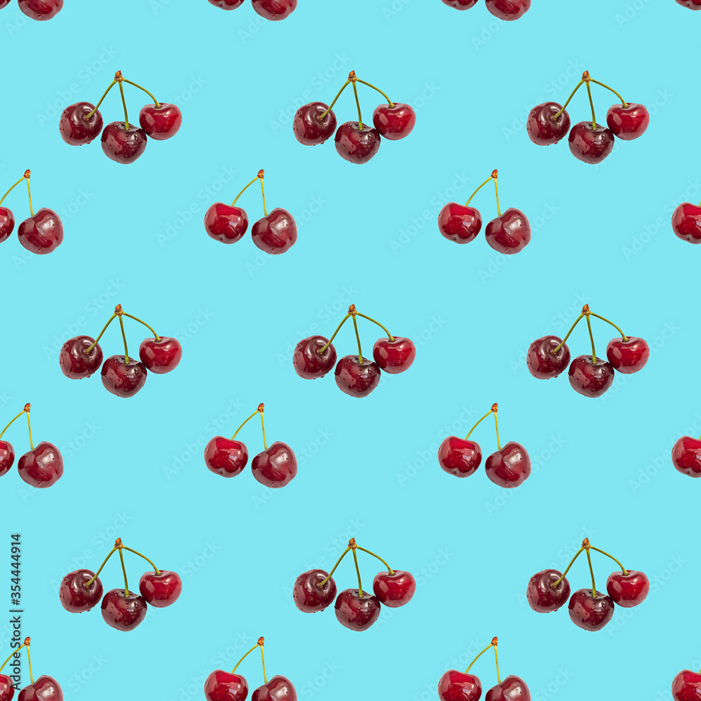 Seamless pattern of red fresh cherry on colored background Seamless pattern of red fresh cherry on colored background