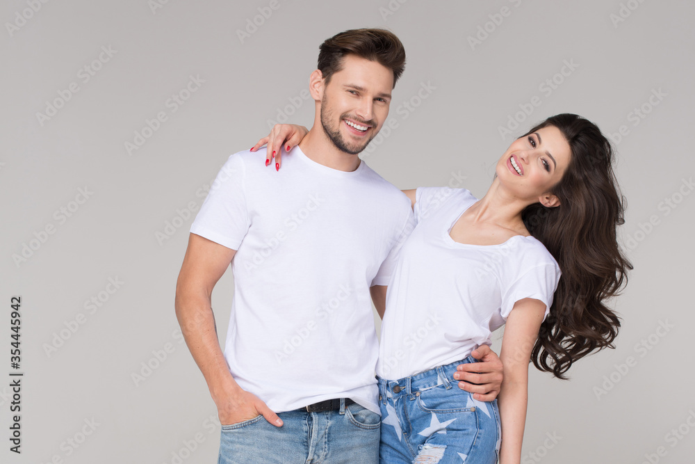 Happy summer cute couple wearing blue jeans Happy summer cute couple wearing blue jeans