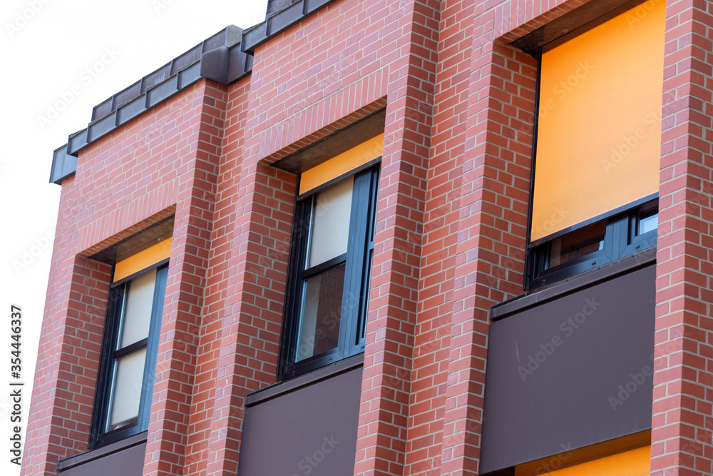 modern office building with blue and yellow windows 