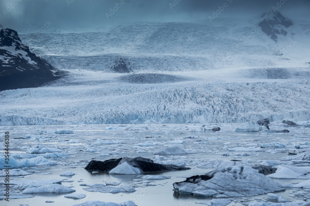 The beautiful Fjallsarjokull glacier and icebergs of the Fjallsarlon lagoon in the Vatnajokull National Park, Southeast Iceland.