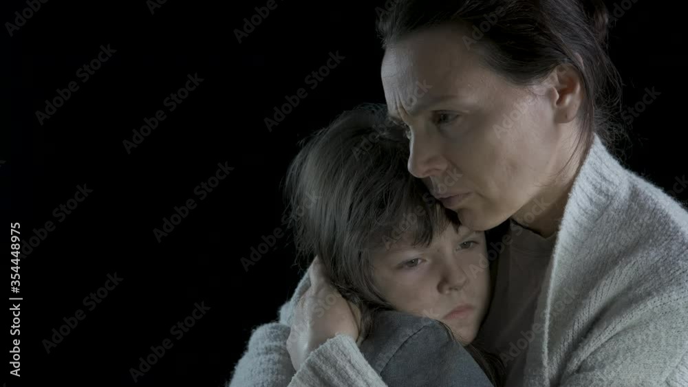 Concept of despair. Desperate mother hugs her sad little daughter. Concept of despair. Desperate mother hugs her sad little daughter.