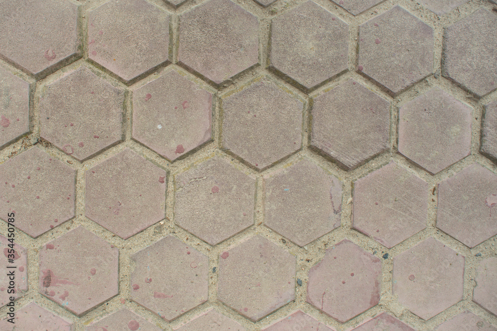 Top view of the hexagonal gray street tile background texture.