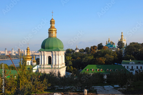 Fotografija Church with green-gold doom in Ukraine where river streams