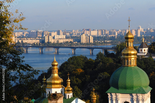 Obraz na plátně Church with green-gold doom in Ukraine where river streams