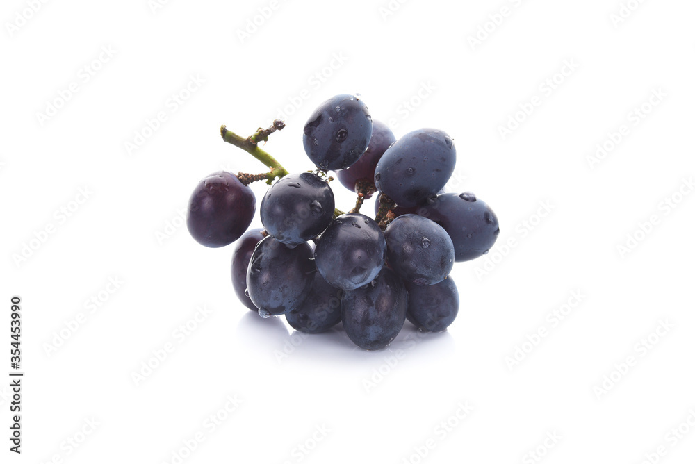 Dark blue grape with leaves isolated on white background. Dark blue grape with leaves isolated on white background.