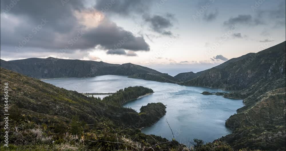 Timelapse Lagoa do Fogo Fire Lake 4k moving time lapse Video clip from sunset on Sao Miguel Island, Azores, Acores, Portugal. Pink sky during twilight with clouds in windy conditions. Timelapse Lagoa do Fogo Fire Lake 4k moving time lapse Video clip from sunset on Sao Miguel Island, Azores, Acores, Portugal. Pink sky during twilight with clouds in windy conditions.