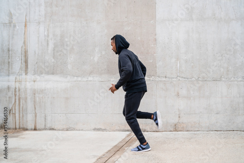 Portrait of fitness man running. © Mego-studio