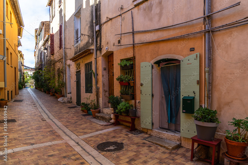 A colorful pedestrian alleyway in the picturesque resort town of Cassis in  Southern France