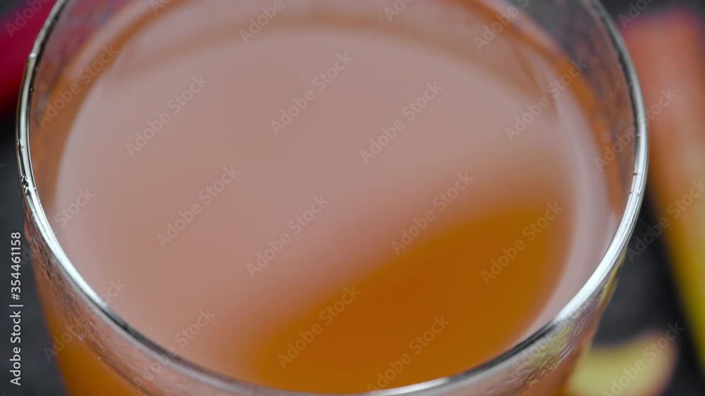 Fresh made Rhubarb Juice on a rotating plate (seamless loopable) Fresh made Rhubarb Juice on a rotating plate (seamless loopable)