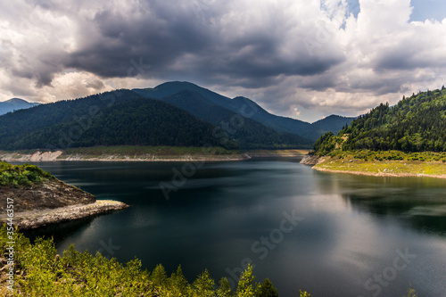 Mountain lake view before rain - Gura Apelor Dam in Romania