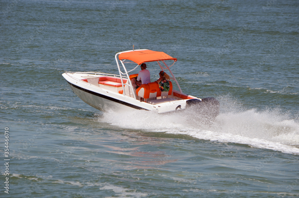 Fototapeta premium Sporty runabout motor boat powered by two outboard engines.