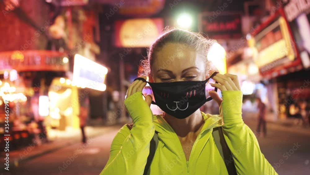 Woman close up look caucasian at Pattaya Walking Street with wearing protective medical mask. Lockdown quarantine isolation. Health virus protection coronavirus epidemic sars-cov-2 covid-19 2019-ncov. Woman close up look caucasian at Pattaya Walking Street with wearing protective medical mask. Lockdown quarantine isolation. Health virus protection coronavirus epidemic sars-cov-2 covid-19 2019-ncov.