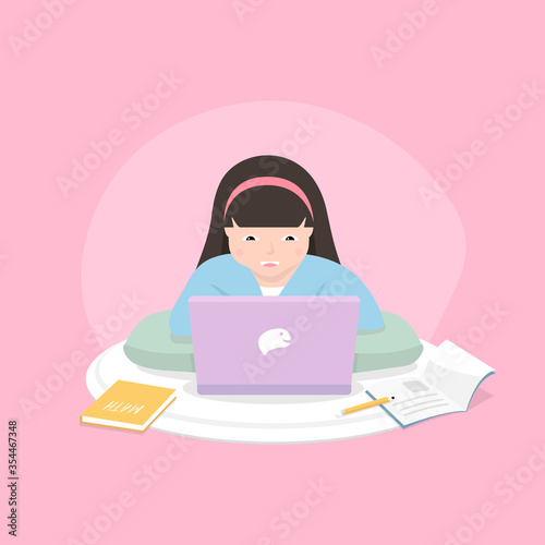 Distance learning solutions. Cute little girl using laptop for online education at home. Learn at home concept.