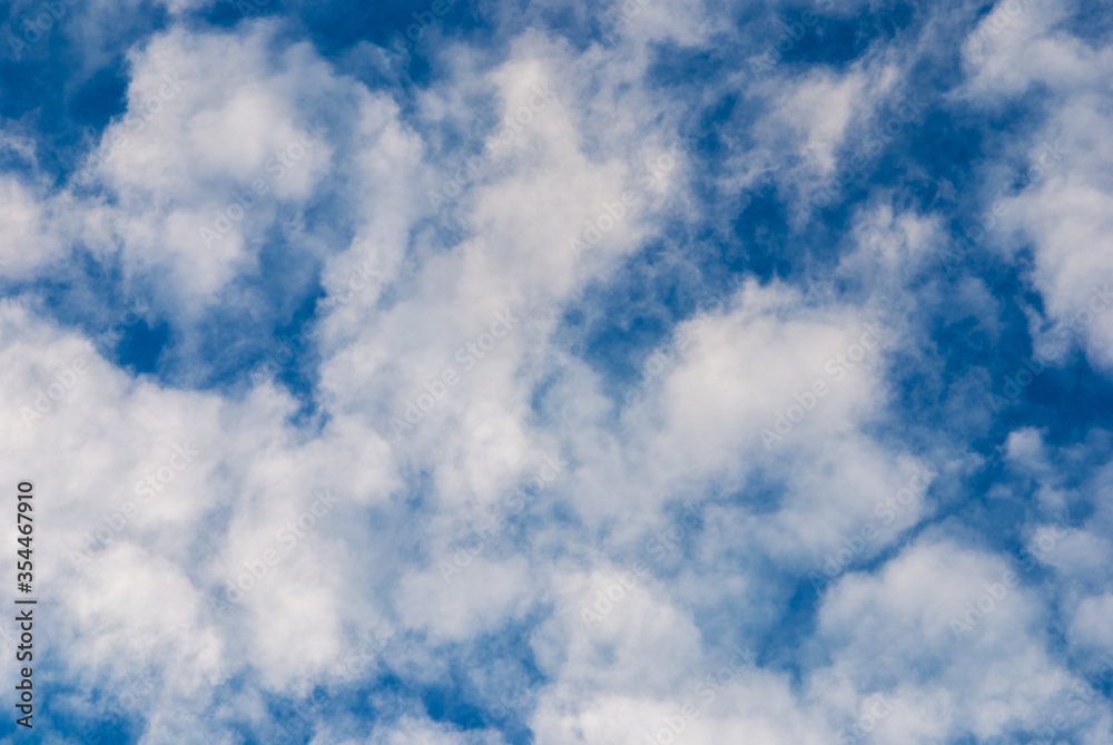 deep blue sky with random airy white clouds deep blue sky with random airy white clouds
