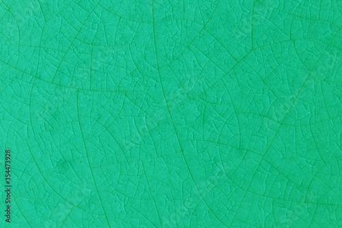 Green crack ceramic tile. Nature color of glazed tile texture abstract background. 
