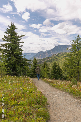 Man hiking on trail near Sunshine Village Ski Resort in Banff National Park, Canada