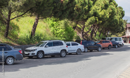 Cars in the parking lot along the street