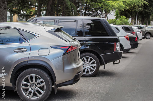 Cars in the parking lot along the street