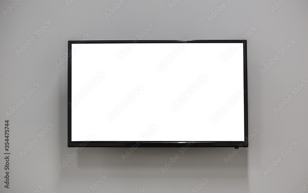 TV on the wall with a white screen.