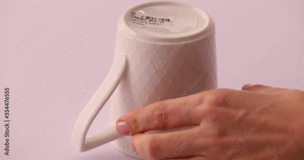 Life hack: struggling taking off a sticker, adding hot water to a white bowl to easily taking a sticker out 