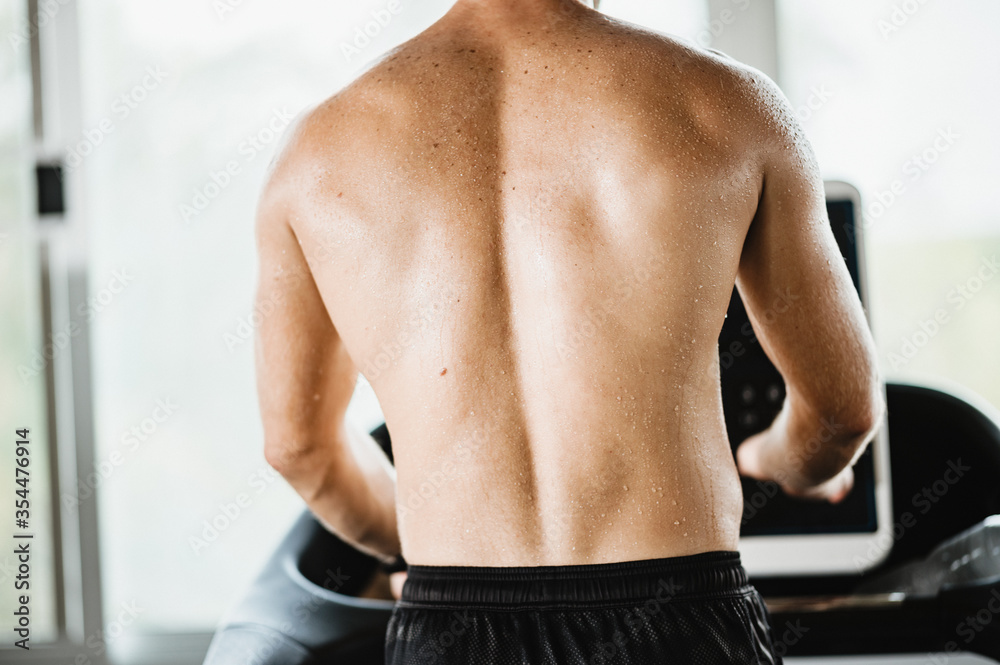 Closeup of drop of sweat on body skin of sport man after workout, exercise concept for weight loss and good health, new normal lifestyle Closeup of drop of sweat on body skin of sport man after workout, exercise concept for weight loss and good health, new normal lifestyle