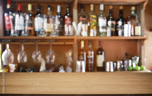 Wood Table Top in Blur Background room interior with empty copy space.